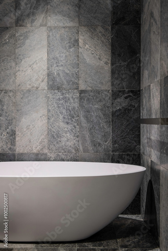 Beautiful bathtub in a bathroom with luxurious and elegant tiles.  