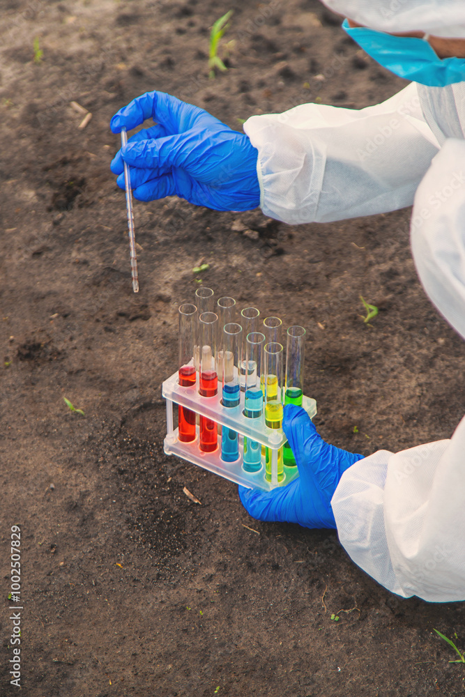 Taking soil samples from the field. Selective focus. Taking soil samples from the field. Selective focus.