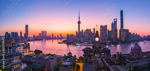 Aerial view of modern city skyline and buildings at sunrise in Shanghai