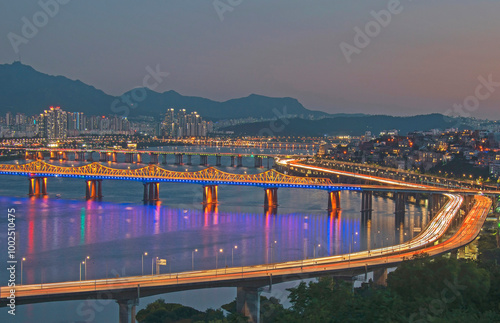 Seongdong-gu, Seoul, South Korea - July 15, 2020: Night view of Yongbigyo Bridge and Olympic Boulevard Expressway with bridges on Han River and downtown photo