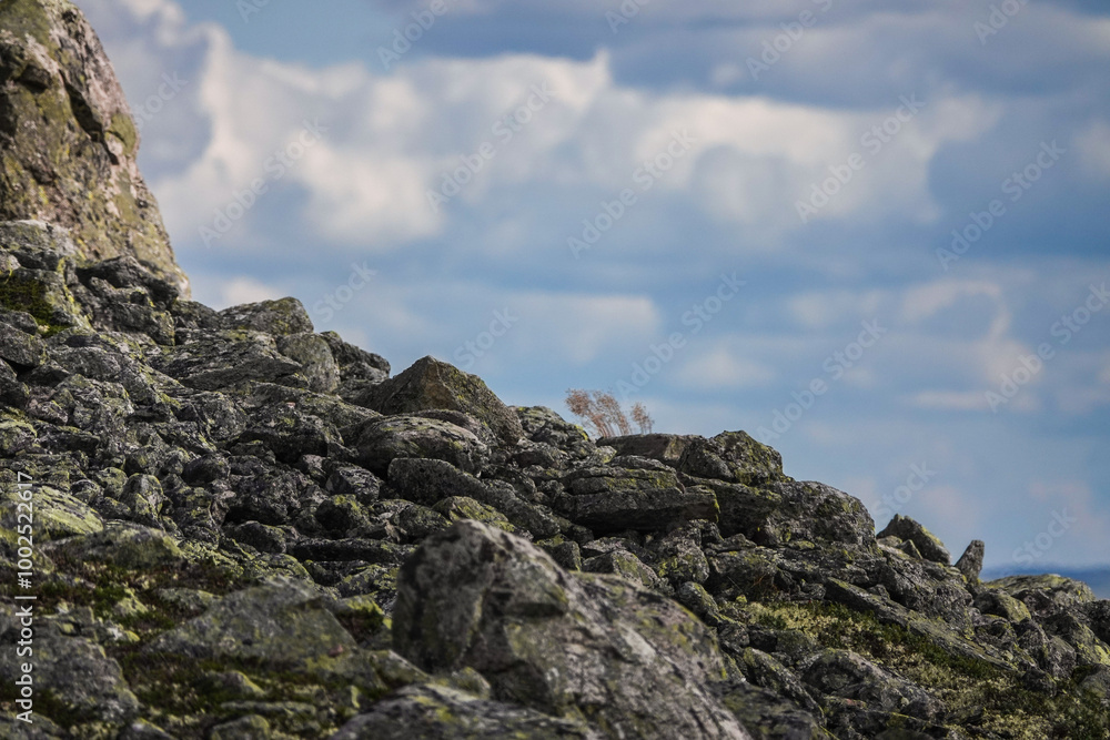 Fototapeta premium Rocks in the mountains, clouds in the sky