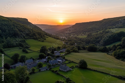 the sun sets over a valley in the uk photo