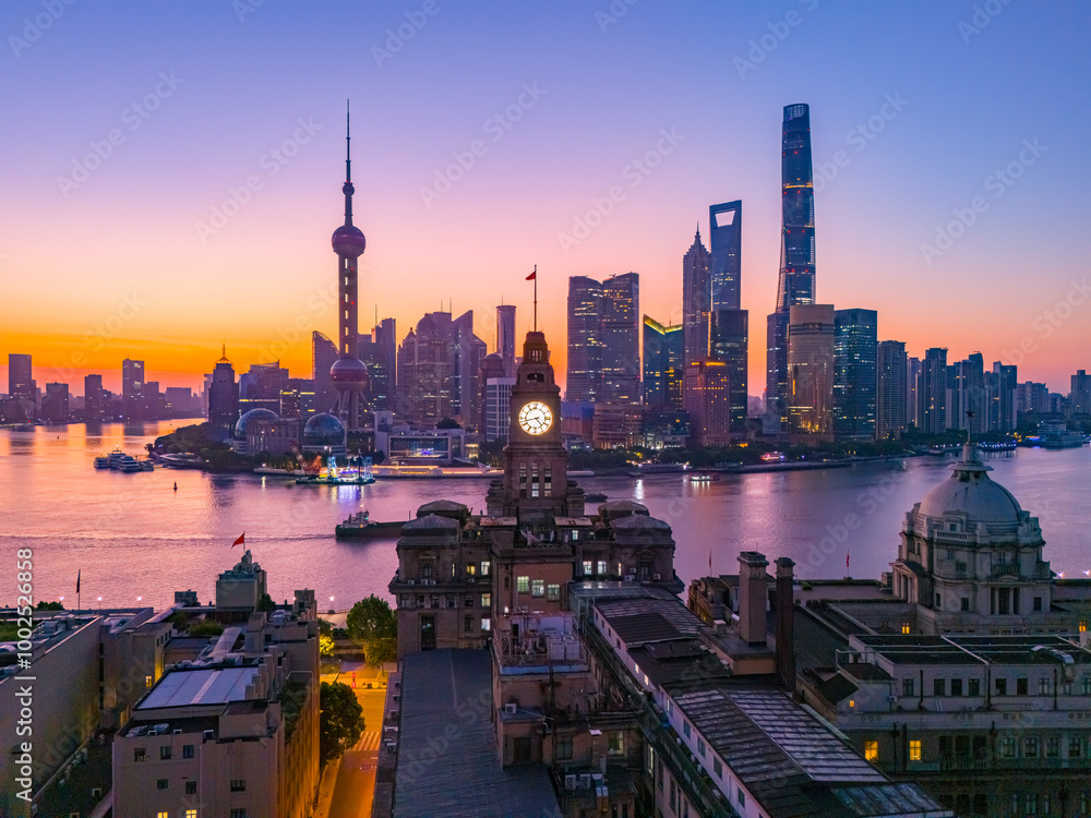 Obraz premium Aerial view of modern city skyline and buildings at sunrise in Shanghai