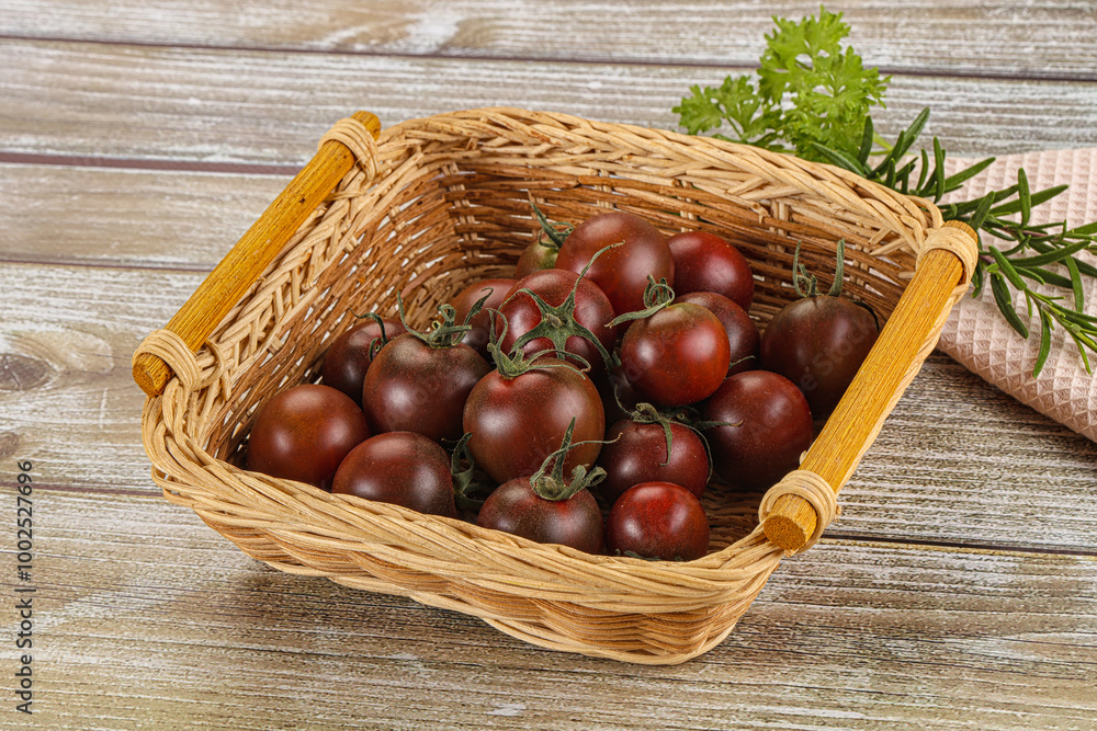 Juicy ripe black cherry tomato Juicy ripe black cherry tomato