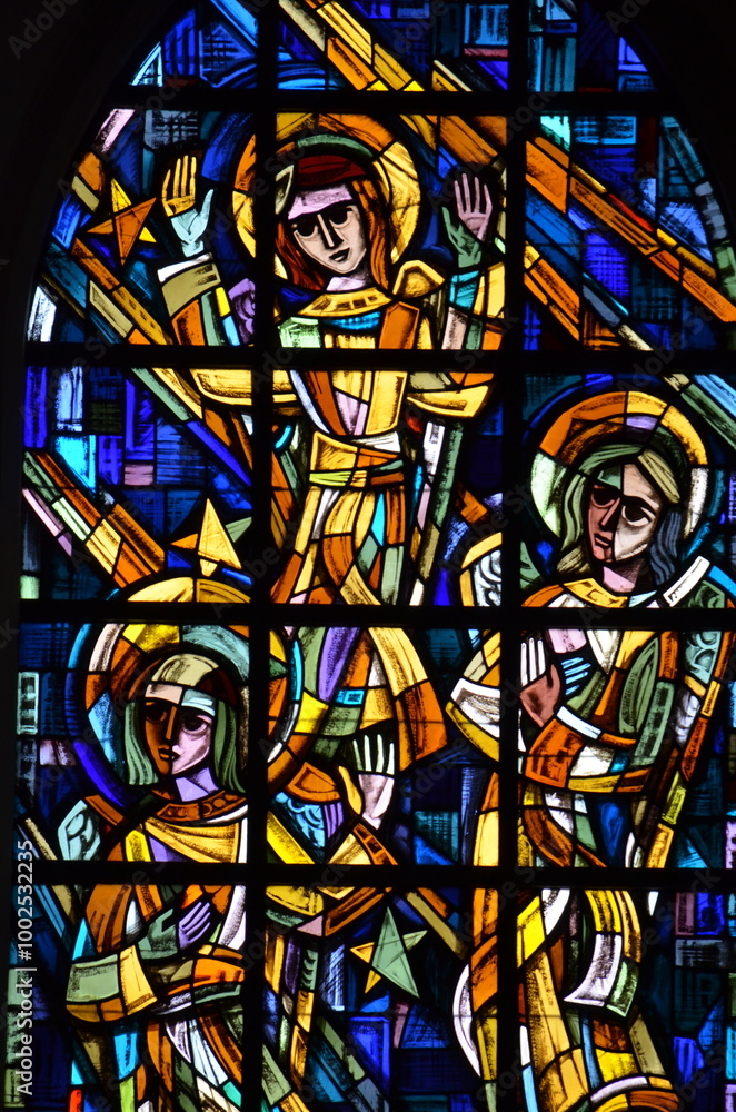 Stained glass window detail featuring angels with vibrant colors, showcasing intricate religious artwork in a Brussels church. The vivid design highlights the spiritual essence of the scene
Stained glass window detail featuring angels with vibrant colors, showcasing intricate religious artwork in a Brussels church. The vivid design highlights the spiritual essence of the scene