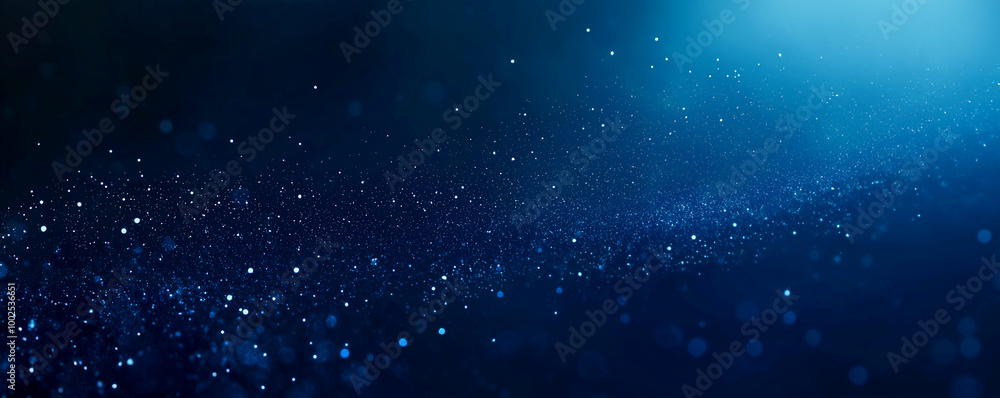 Fototapeta premium Dark blue background with glowing lights and bokeh, creating an atmosphere of mystery and magic.