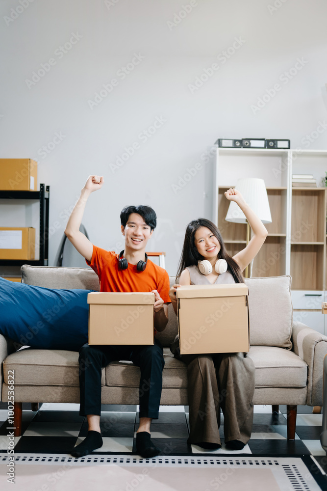 attractive couple man and woman with big boxes moving into a new house, new apartment for couple the new home, Moving house. attractive couple man and woman with big boxes moving into a new house, new apartment for couple the new home, Moving house.