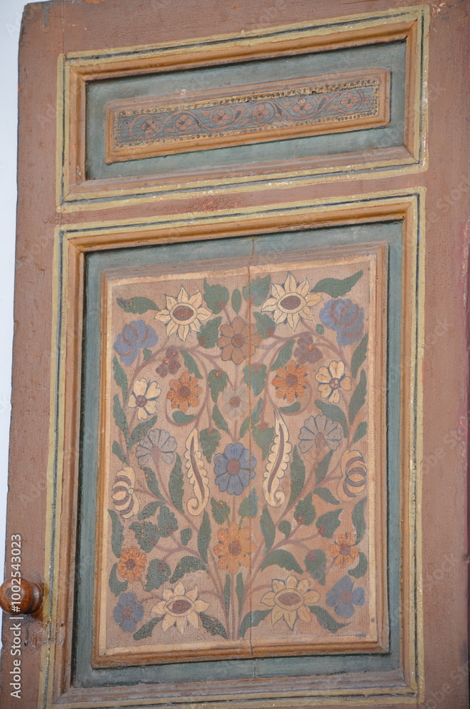 Ornate floral painted wood panel in earthy tones, showcasing traditional Moroccan craftsmanship with intricate flower patterns A beautiful example of Moroccan heritage art and decoration in Marrakesh
Ornate floral painted wood panel in earthy tones, showcasing traditional Moroccan craftsmanship with intricate flower patterns A beautiful example of Moroccan heritage art and decoration in Marrakesh