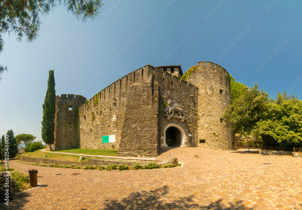 Scenic view of historic Castle in Gorizia (13th century), Friuli-Venezia Giulia, Italy at sunny summer day. Lion of Venice over the gate Scenic view of historic Castle in Gorizia (13th century), Friuli-Venezia Giulia, Italy at sunny summer day. Lion of Venice over the gate