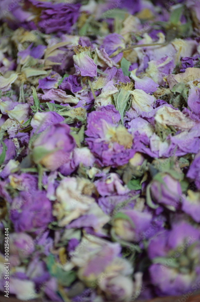 Close-up of dried purple roses used in Moroccan markets, showing the vibrant texture and color of the petals.
Close-up of dried purple roses used in Moroccan markets, showing the vibrant texture and color of the petals.