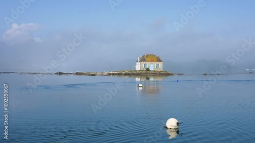 Idyllic Brittany scene with cottage on calm water, Saint Cado, Nichtarguer