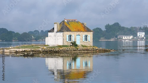 Idyllic Brittany scene with cottage on calm water, Saint Cado, Nichtarguer