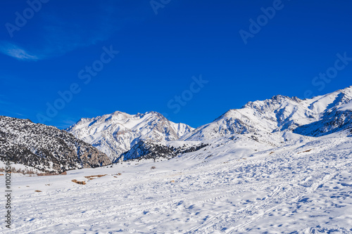 Wallpaper Mural Winter landscape with mountains covered with snow under a blue sky during the day Torontodigital.ca