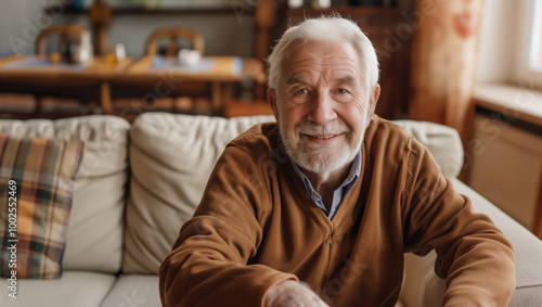 Portrait of happy senior man smiling at home