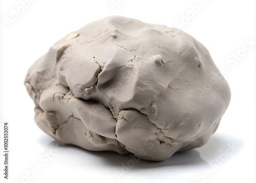 Grey modelling clay lump shape isolated on white background photo