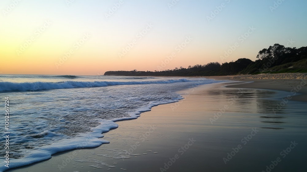 Obraz premium Tranquil Beach at Sunset with Gentle Waves