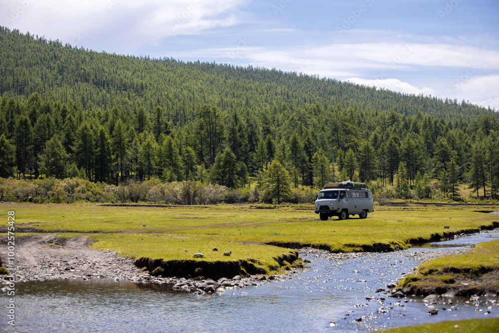 Fototapeta premium Russian off-road van with tourists moving somewhere in Mongolia