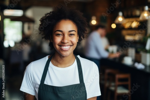 Smiling portrait of a young female African American waitress