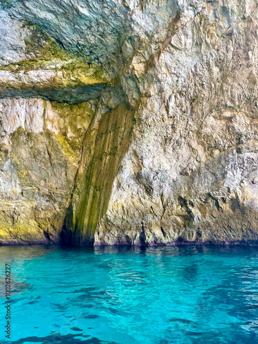 Cliff rock on coastal rock formation in the quiet Mediterranean waters in Malta Island