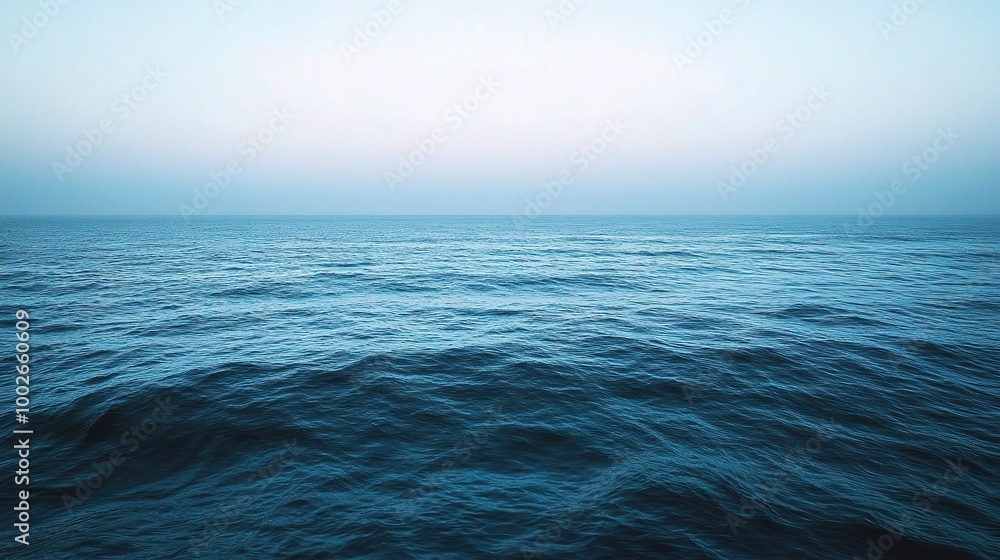 Obraz premium Calm Ocean View Under Soft Blue Sky