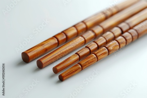 Minimalist mockup of bamboo chopsticks placed on a clean white background, sushi with wooden chopsticks