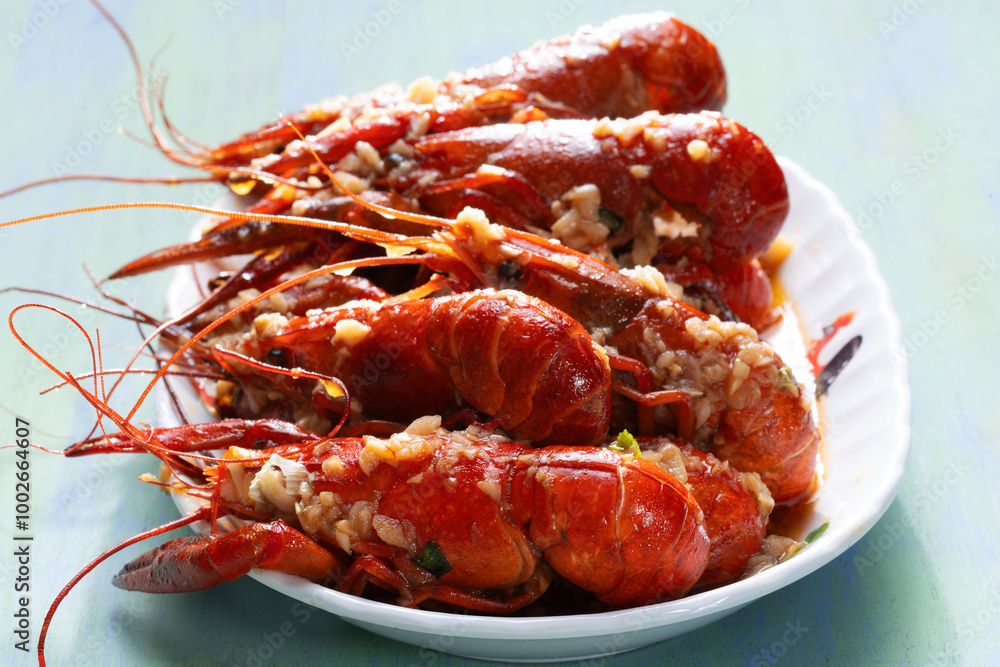 plate of traditional garlicky spicy sichuan red crawfish