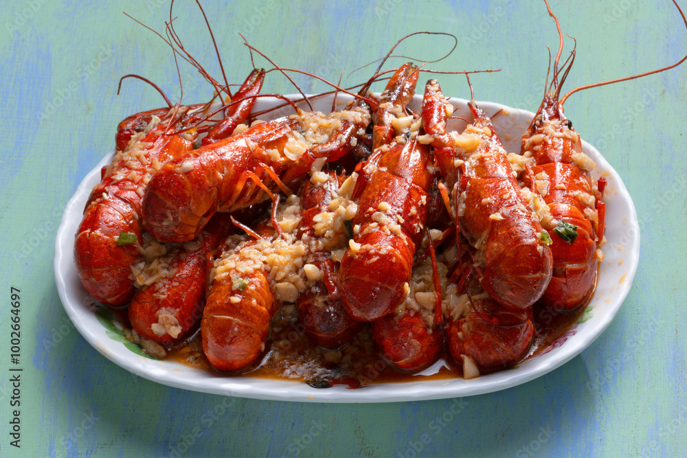 plate of traditional garlicky spicy sichuan red crawfish