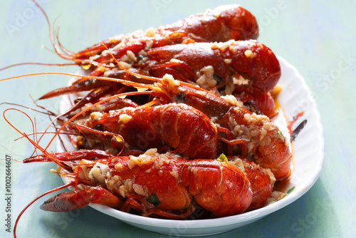 Obraz na płótnie plate of traditional garlicky spicy sichuan red crawfish w salonie