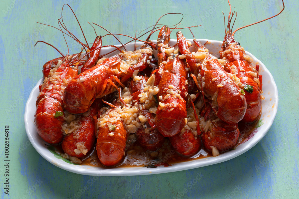 plate of traditional garlicky spicy sichuan red crawfish