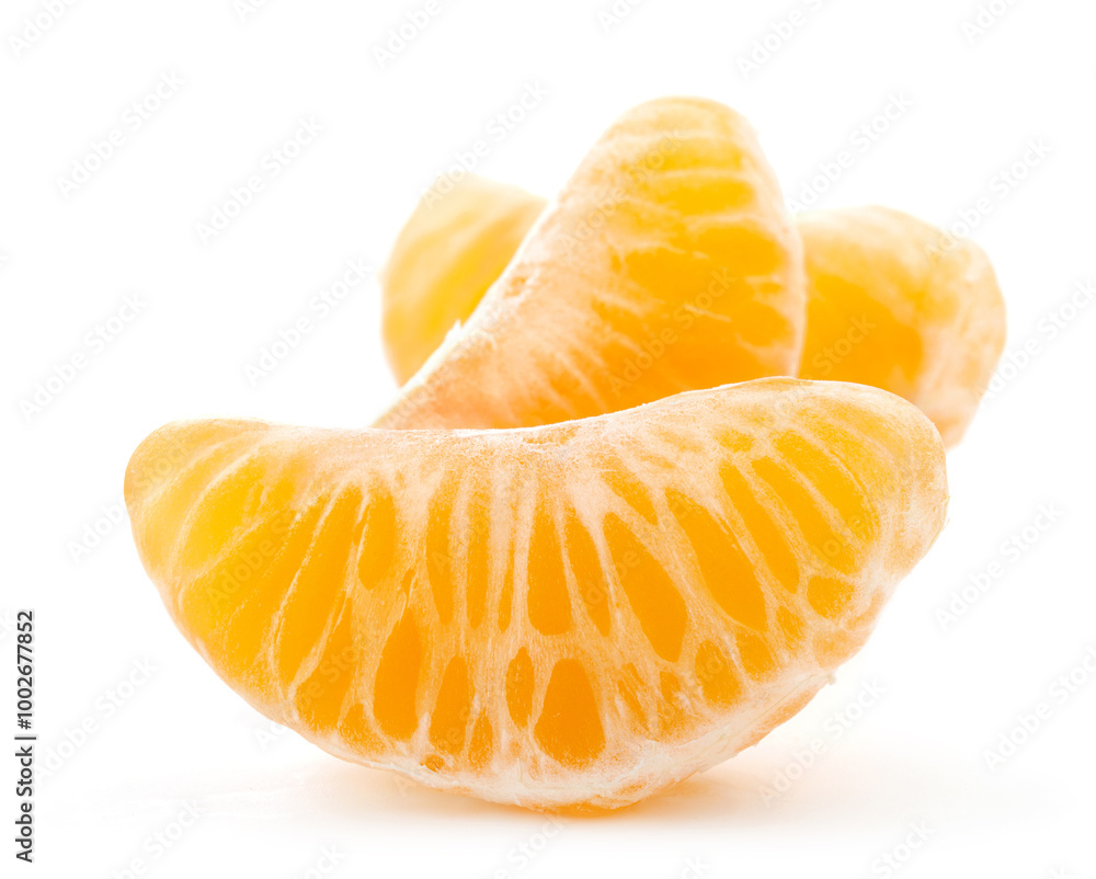 Peeled pieces or slices of mandarin, tangerine or clementine isolated on white background Peeled pieces or slices of mandarin, tangerine or clementine isolated on white background