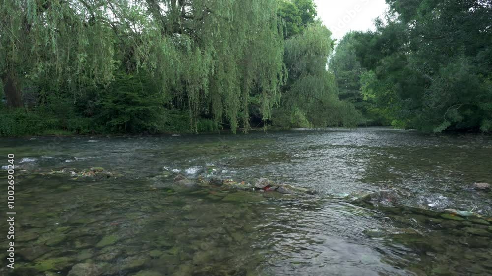 The River Wye flowing through Ashford in the Water in the Peak District National Park. The River Wye flowing through Ashford in the Water in the Peak District National Park.