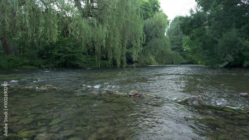 The River Wye flowing through Ashford in the Water in the Peak District National Park. photo