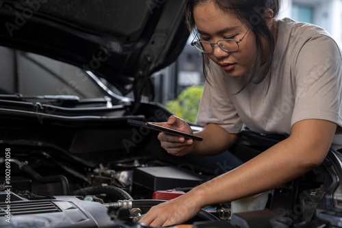 A young woman is calling for assistance because her car broke down