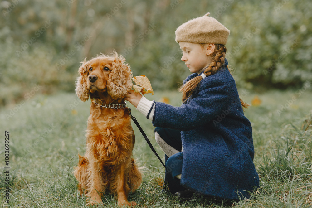 Little girl walks in autumn forest with a dog Little girl walks in autumn forest with a dog