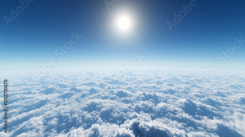 A bright skyscape above scattered clouds, with a vivid blue sky and a tiny bright sun