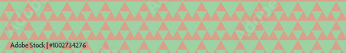 A repeating geometric pattern featuring triangular shapes in mint green and peach tones, creating a visually appealing design.