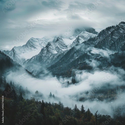 Misty morning in the snowy mountains with clouds over a scenic alpine landscape