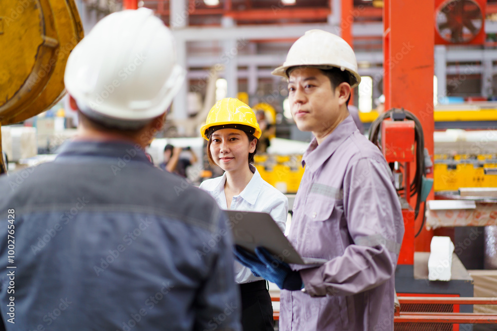 Industrial engineer team works together in factory. Industrial engineer team works together in factory.