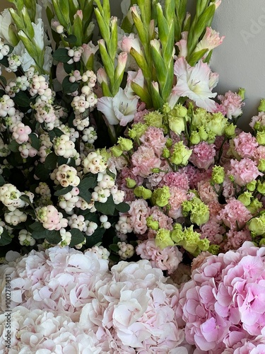 Beautiful bunches Hydrangea, carnations, eustoma, gladiolus, snowberries, close up vertical image 