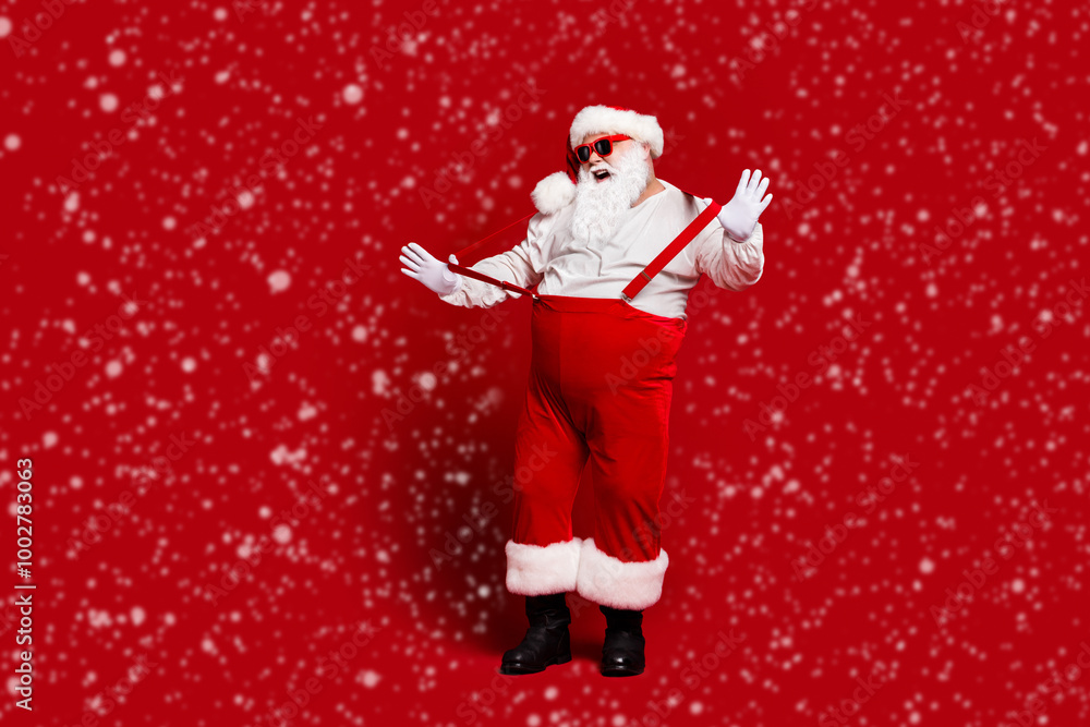 Full length body size view of his he attractive cheerful fat white-haired Santa having fun pulling suspenders fooling isolated bright vivid shine vibrant red burgundy maroon color background Full length body size view of his he attractive cheerful fat white-haired Santa having fun pulling suspenders fooling isolated bright vivid shine vibrant red burgundy maroon color background
