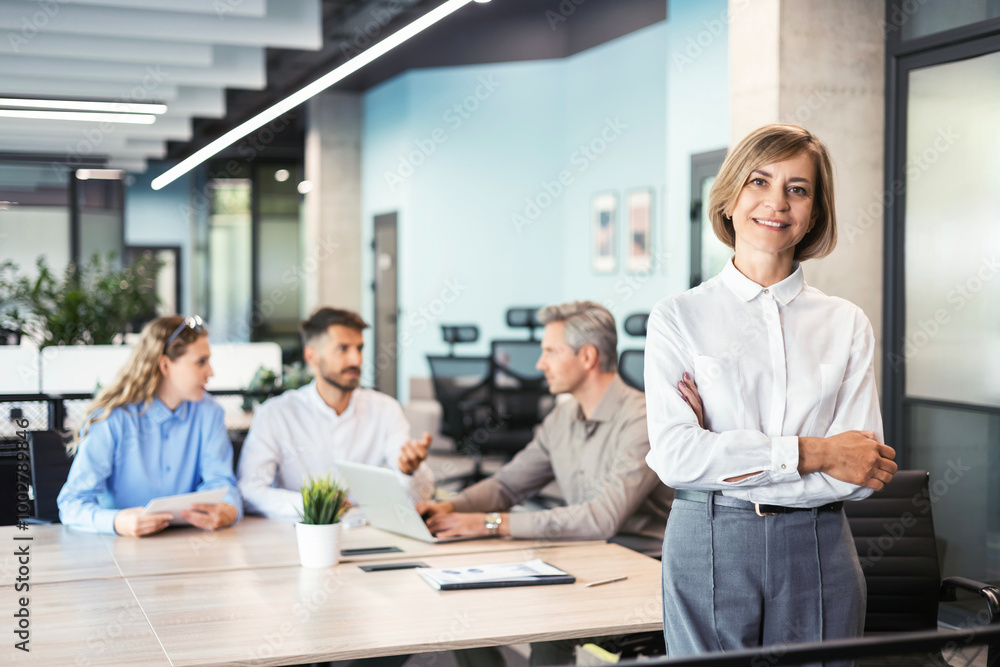 Face of beautiful middle aged woman on the background of business people. Face of beautiful middle aged woman on the background of business people.