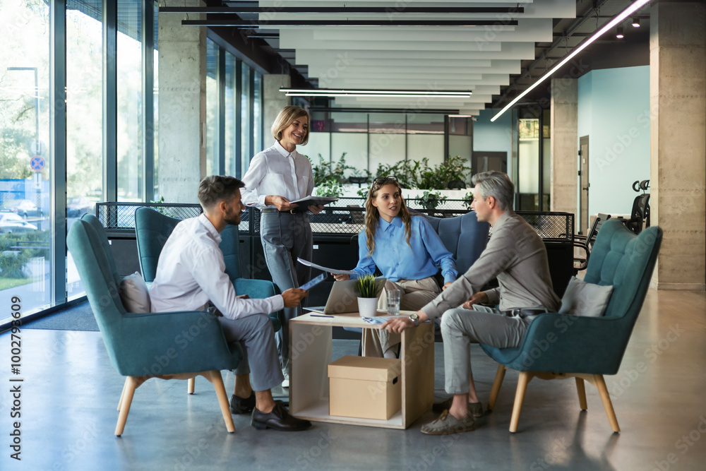 Business team discussing together business plans in office. Business team discussing together business plans in office.