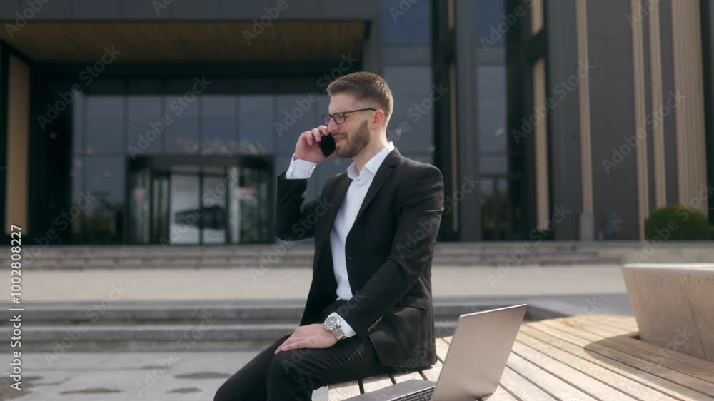 Stressed Businessman in a Suit Receives Bad News Over Phone in an Urban Setting Stressed Businessman in a Suit Receives Bad News Over Phone in an Urban Setting