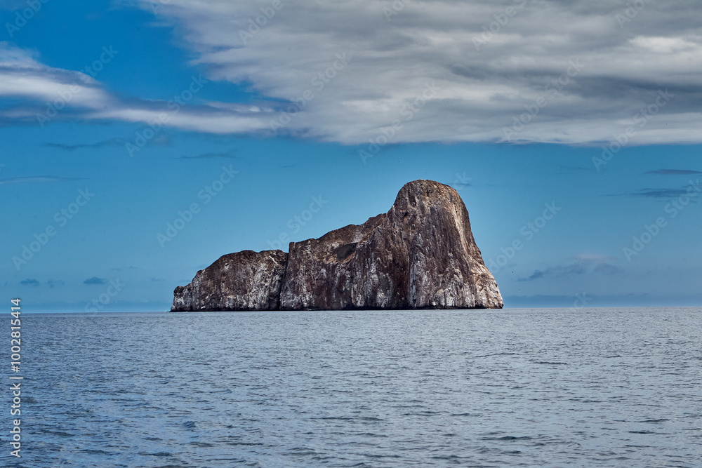 Kicker Rock, also known as León Dormido, is one of the most iconic landmarks in the Galápagos Islands. This stunning rock formation rises dramatically from the ocean. Kicker Rock, also known as León Dormido, is one of the most iconic landmarks in the Galápagos Islands. This stunning rock formation rises dramatically from the ocean.