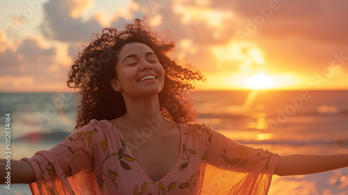 A woman joyfully enjoys the sunset on a tranquil beach, symbolizing peace, freedom, and bliss amidst the stunning backdrop of the glowing horizon. photo