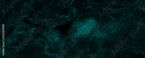 Scattered heavy dark green jade colored texture grunge texture on a dark sky surface lightning abstract background. Abstract background with dark jade rough grainy stone or concrete wall texture.