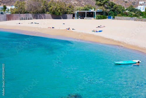 Mikonos, Greece: Agrari Beach with blue sea, wild and quiet, famous for diving, snorkeling and water activity. As most beaches in Mykonos, Agrari Beach is naturism friendly.