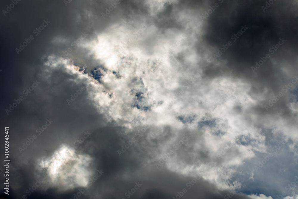 Fototapeta premium Gathering Storm Clouds Illuminated by the Sun