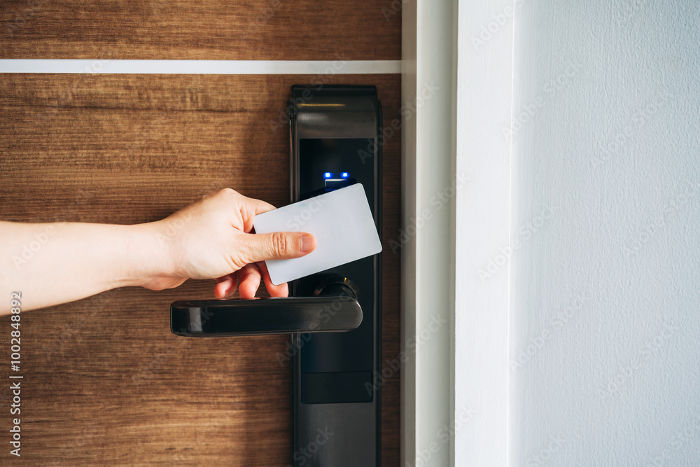 Electronic card key for open door in hotel. Smart card key to lock and unlock door. Security systems and protection concept. Electronic card key for open door in hotel. Smart card key to lock and unlock door. Security systems and protection concept.