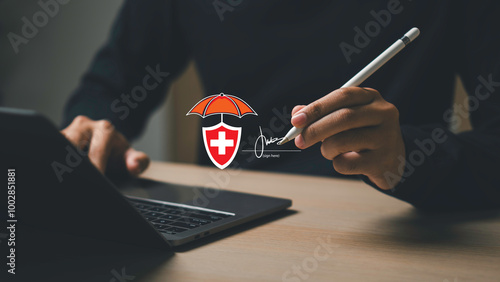 Obraz na płótnie Purchasing insurance concept, A person is signing insurance a document on a laptop. protect for medical, life, car, home, travel. w salonie
